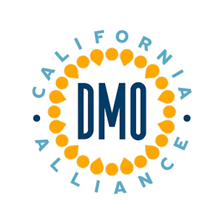 California DMO Alliance logo with inviting blue text, encircled by vibrant orange dots and cheerful blue lettering.
